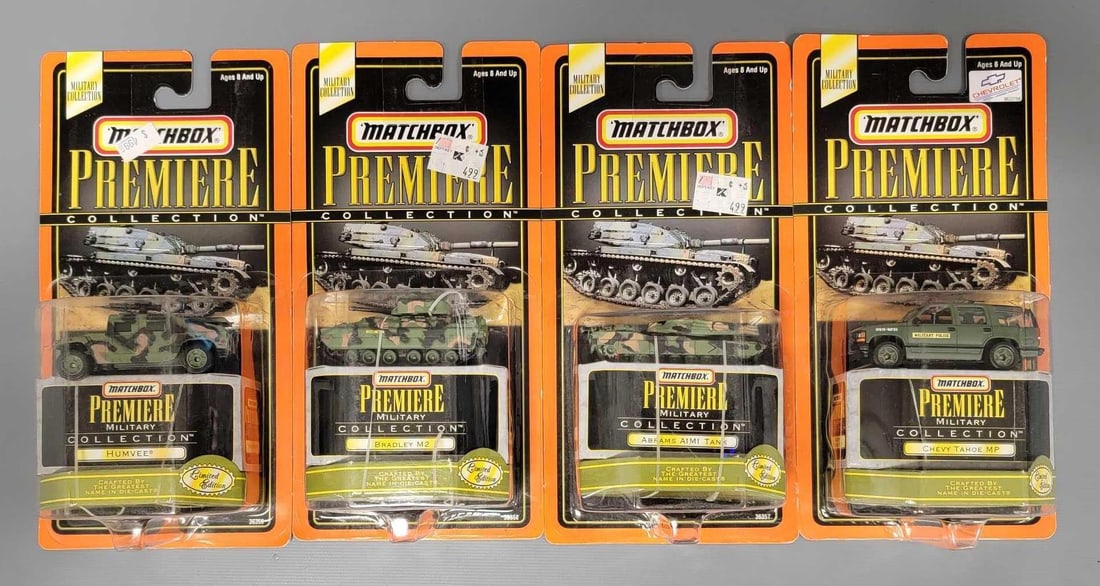 Group of Matchbox Premiere Collection cars in blister packs: Group of Matchbox Premiere Collection cars in blister packs. Consists of four Premiere Collection Military Collection vehicles in excellent plus to near mint condition as seen in the photos.