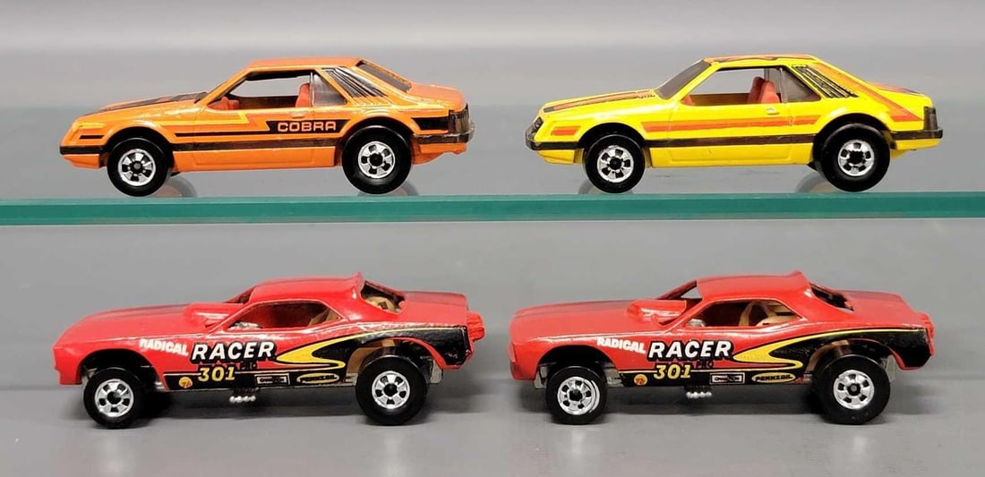 Group of Hot Wheels Drag Cars and Mustangs: Group of four Hot Wheels Drag Cars and Mustangs. Consists of two Radical Race Top Eliminator Drag cars, Mustang Cobra and yellow Mustang. All are in very good to excellent condition as seen in the pho