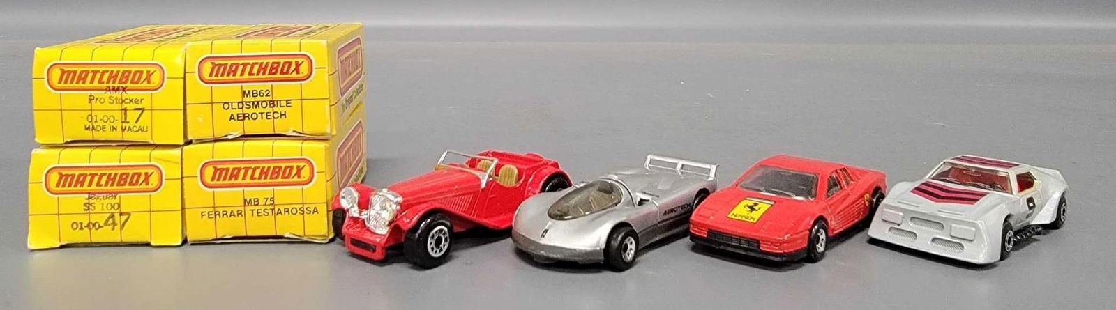 Four Matchbox cars with Ferrari, Oldsmobile, AMX and Jaguar cars in original boxes (1 of 9)