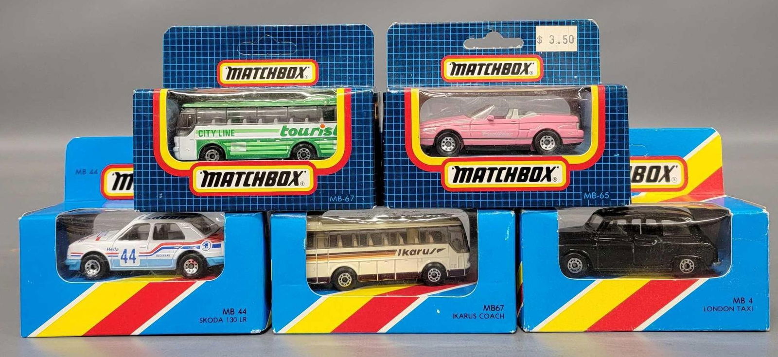 Five Matchbox cars, buses and race car in original boxes (1 of 7)