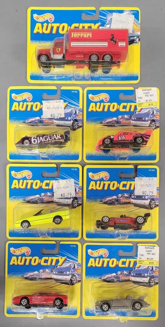 Seven Hot Wheels Auto City Truck, Racing Cars and cars in blister packs: Seven Hot Wheels Auto City Truck, Racing Cars and cars. Consists of Ferrari Kenworth Truck, F1 Race Car, Jaguar Road Course Racing Car, Porshe Road Course Racing Car, Porshe 911 SC Targa, Ferrari 348