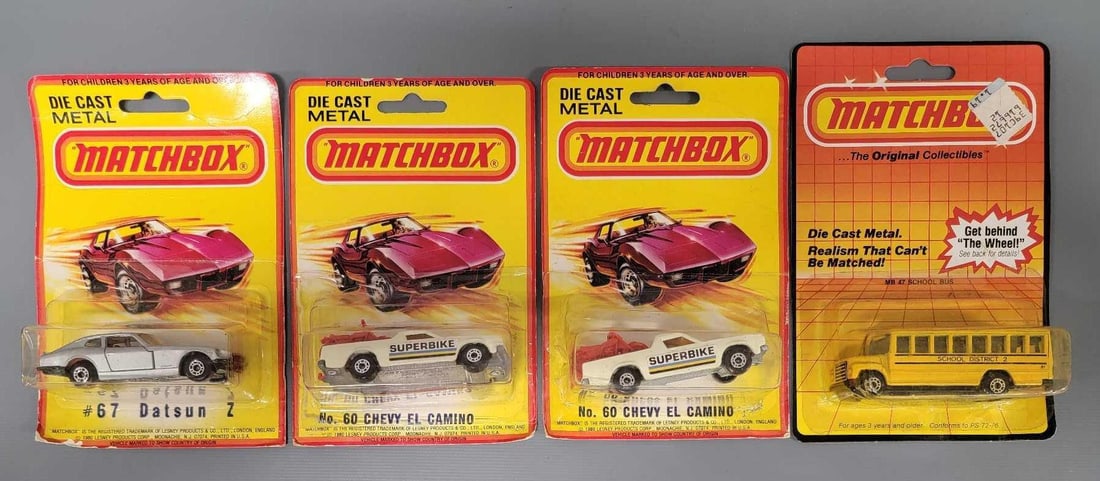 Four Matchbox cars and bus in blister packs (1 of 6)
