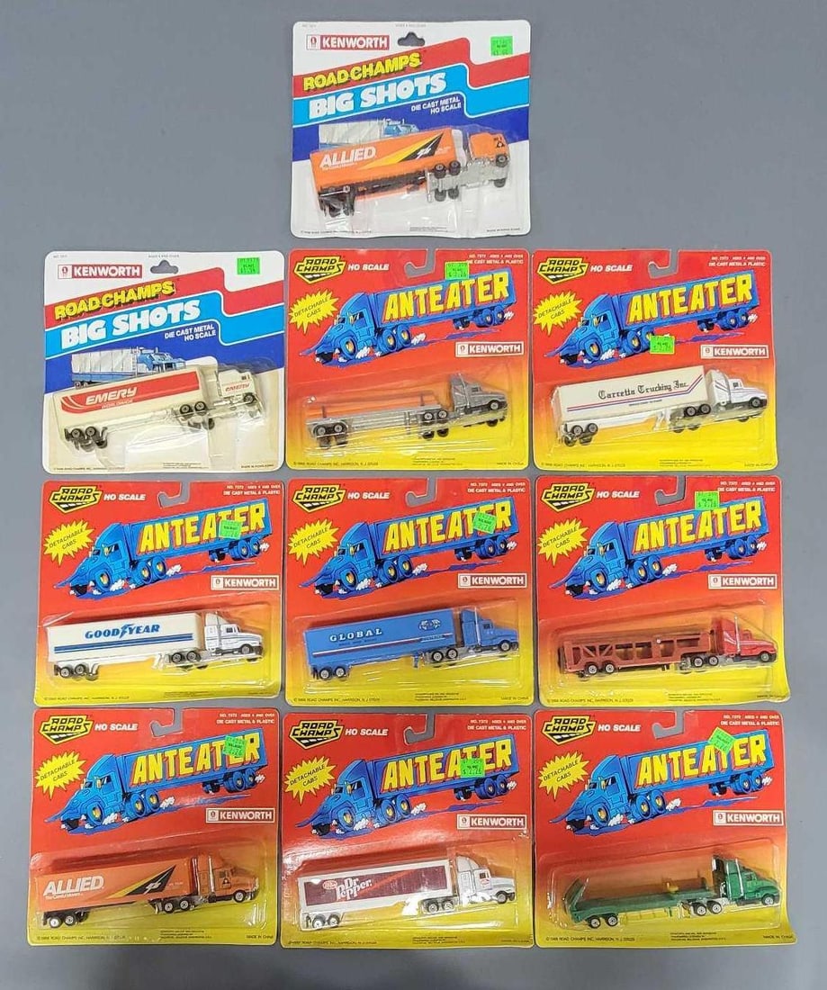 Ten Road Champs Big Shots and Anteater Tractor Trailers in blister packs: Ten Road Champs Big Shots and Anteater Tractor Trailer. There are 8 Kenworth Anteaters and two Kenworth Big Shots in good to very good blister packs as seen in the photos.