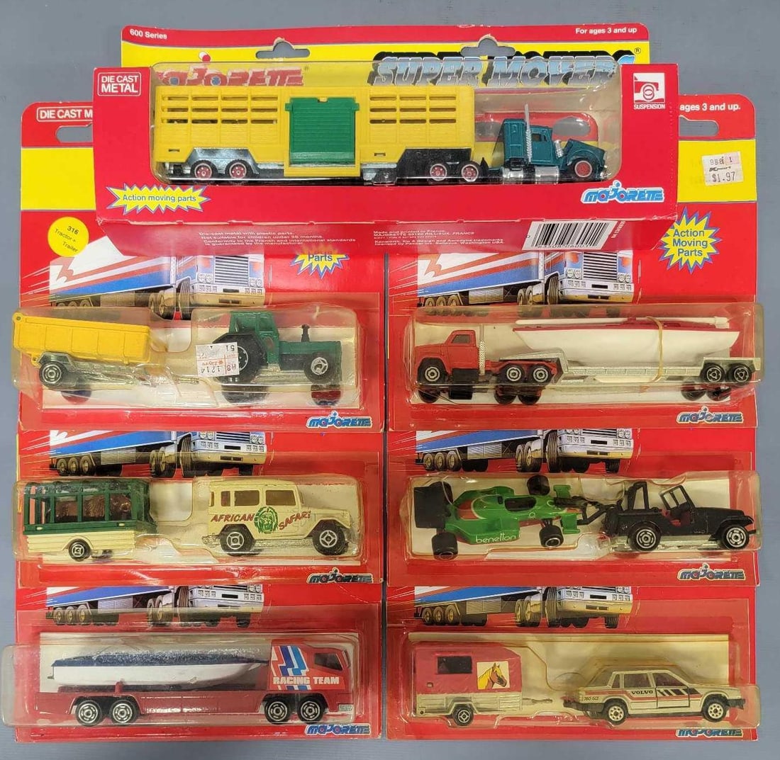 Seven Majorette Trucks, Cars, Agriculture, and Racing vehicles in blister packs and window box: Seven Majorette Trucks, Cars, Agriculture, and Racing vehicles in blister packs and window box. Consists of Farm Equipment, Boat Haulers and Animal Haulers in very good window box and blister packs as