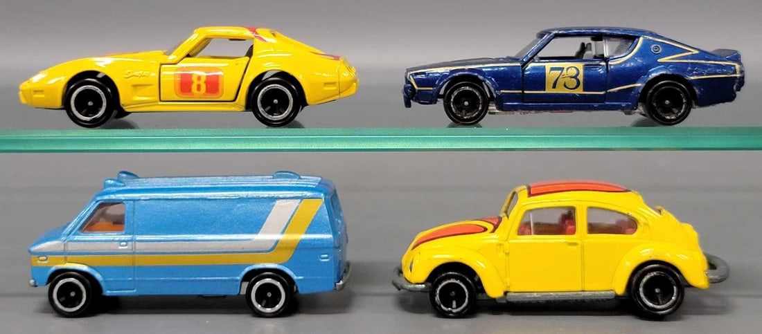 Four Tomica Cars Chevrolet, Volkswagen, Nissan cars: Four Tomica Cars Chevrolet, Volkswagen, Nissan cars consisting of Chevrolet Van, Chevrolet Corvette, Volkswagen Beetle and a Nissan Skyline 2000GT in very good to excellent condition as seen in the ph