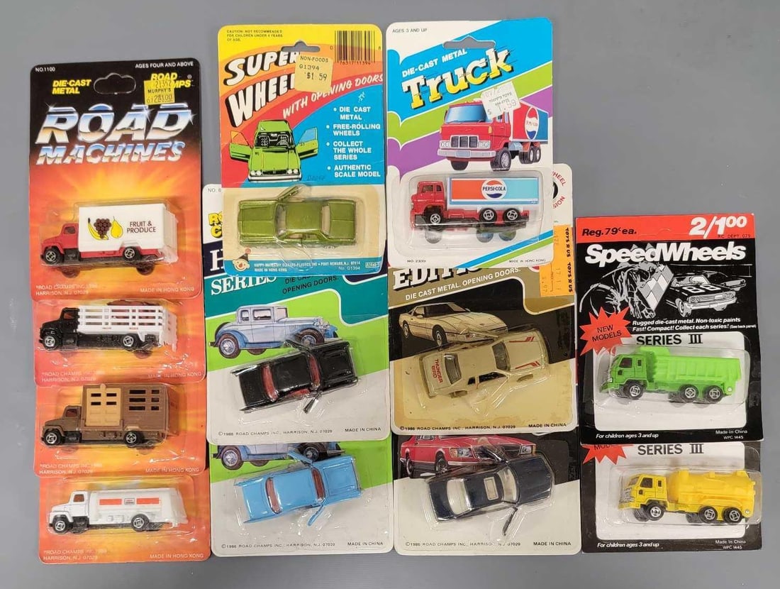 Twelve 1980s diecast cars and truck on sealed blister cards: Twelve 1980s diecast cars and truck on sealed blister cards includes 4 Road Machines delivery trucks, 1 Road Champs Special Editions, 1 Road Champs Future Classics, 2 Road Champs Heritage series, 2 Sp