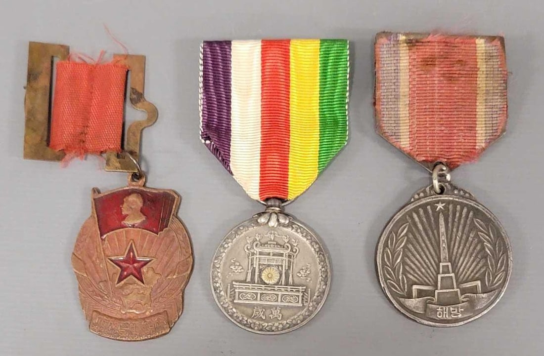 Three WWII Medals: Three WWII Medals. Consists of Japanese Showa Grand Enthronement Commemorative Medal, 1945 Korean Liberation Comemmorative Medal and a 1952 Liberation of Tibet Medal in plastic bag in excellent condit