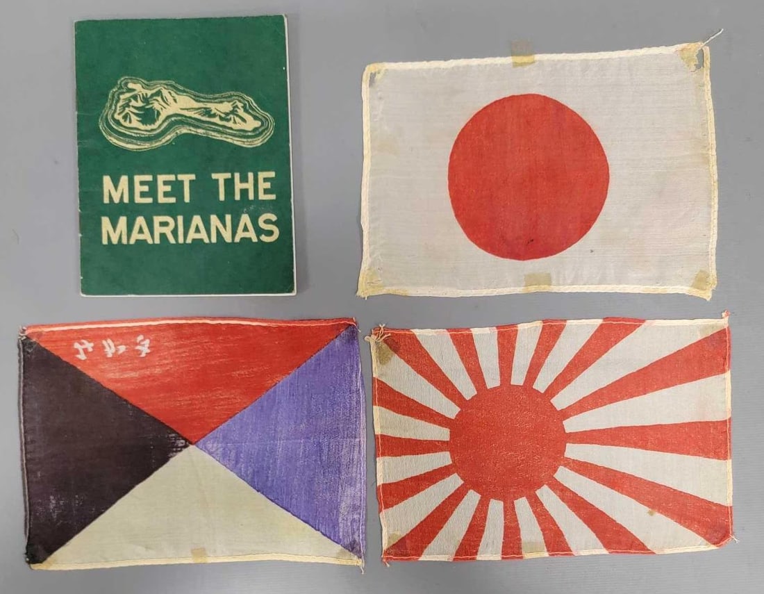 Four Japanese Flags and a Meet the Marians booklet: Four Japanese Flags and a Meet the Marians booklet. Consists of Japanese Imperial Z flag, Rising Sun flag, Meatball flag and a Meet the Marianas Pocket Guide. All in good to very good condition as see
