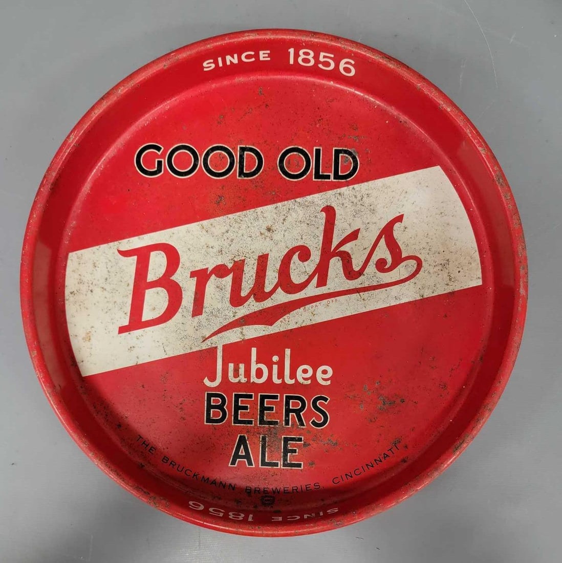 1940's Brucks Jubilee Beers Ale metal serving tray: 1940s Good Old Brucks Jubilee Beers Ale Since 1856 metal Serving Tray with white banner in good to very good condition as seen in the photos.
