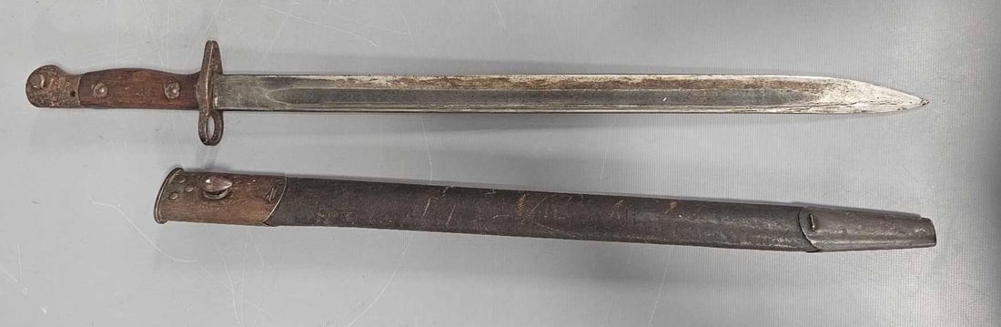 1907 British bayonet in scabbard: 1908 British bayonet in scabbard with other marking on both sides of the blade close to the hilt as seen in the photos.