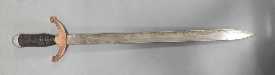 WWI theatre made fighting knife from bayonet: WWI theatre made fighting knife from bayonet, has a neat hilt and a section leather handle. Measures 22 inches overall.