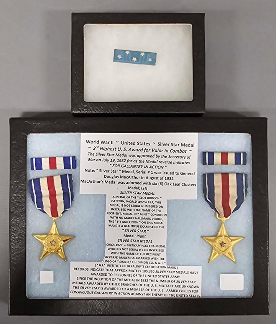 Two items of US WWII and Vietnam medals: Two items of US WWII medals. Consists of two Silver Star Medals one is of the Slot Brooch WWII era and the other is a Vietnam era and a Medal of Honor ribbon. Both are in window cases in near mint to 