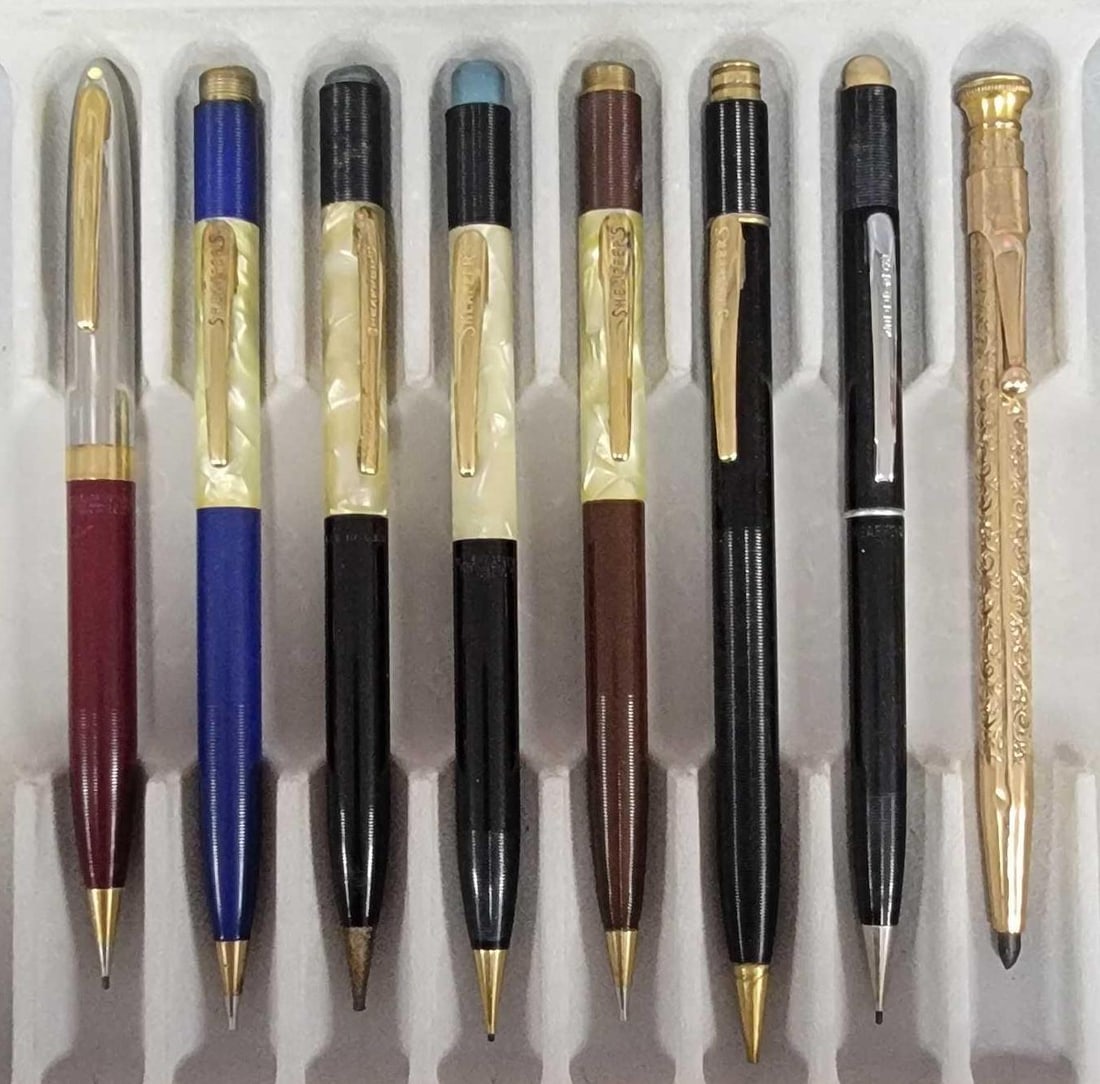 Group of seven Sheaffer and one unmarked gold filled pencils: Group of seven Sheaffer and one unmarked gold filled pencils.�These measure between 3 5/8 and 5 7/16 inches in length with the cap screwed on. These pencils have been used at some point and may