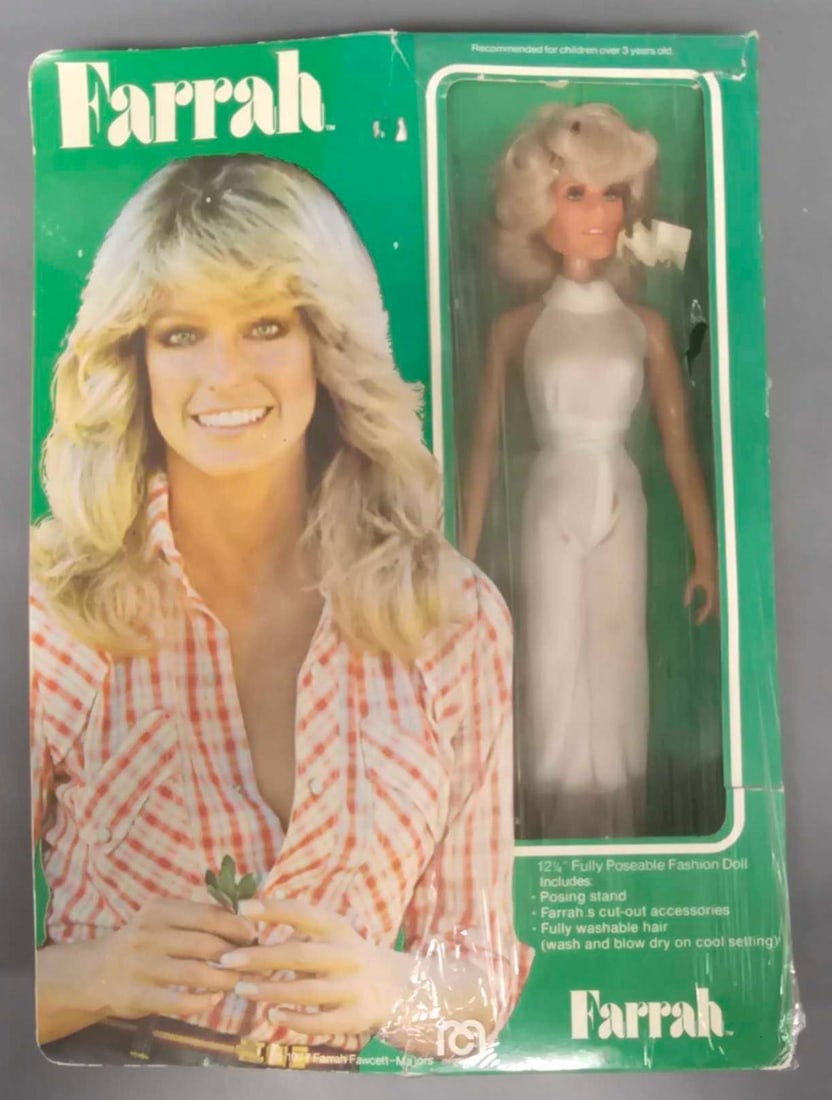 12 inch Poseable Farrah doll by Mego Corp in original box: 12 inch Poseable Farrah doll by Mego Corp is in very good condition with a stain on the front of her pants and come in an excellent original box with some creases on the side, rolled edges, and a tear