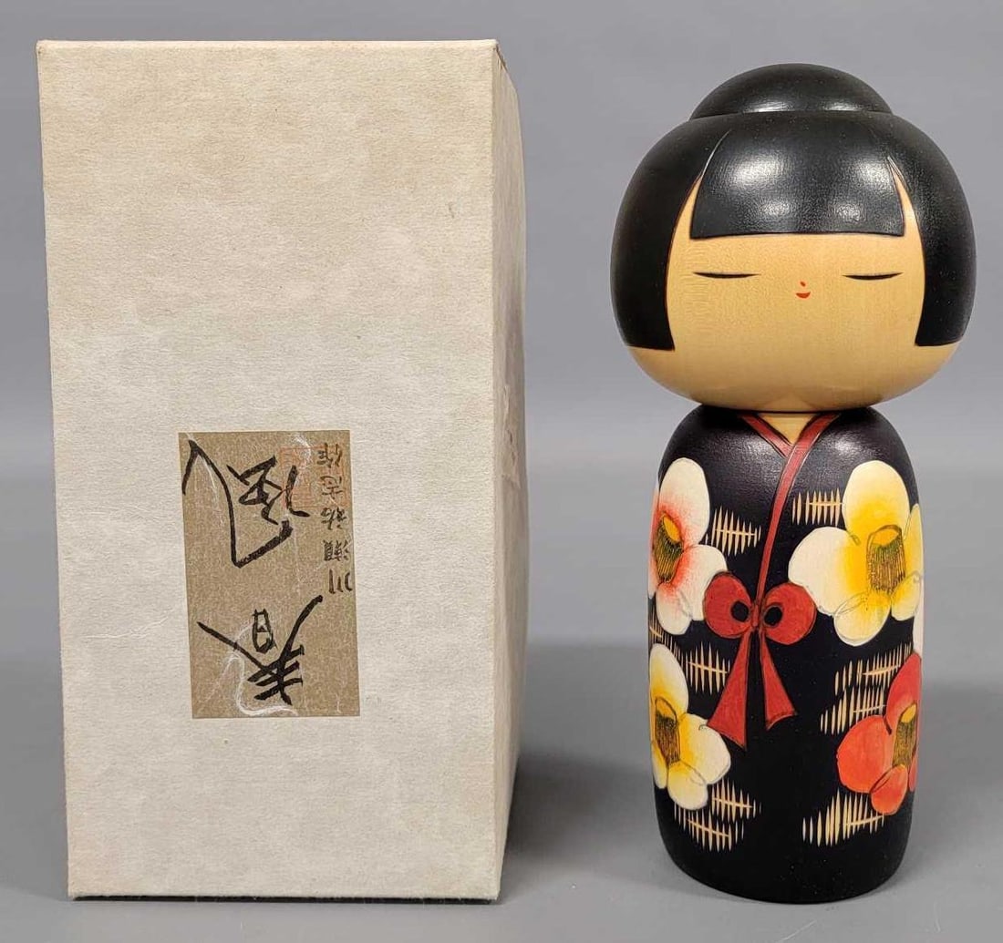 Vintage Japanese Kokeshi Spring Breeze wooden hand painted doll in original box: Vintage Japanese Kokeshi Spring Breeze wooden hand painted dollby Yushio Kawase is in excellent condition. She is wearing a brown kimono with yellow and red flowers and comes in an excellent original 