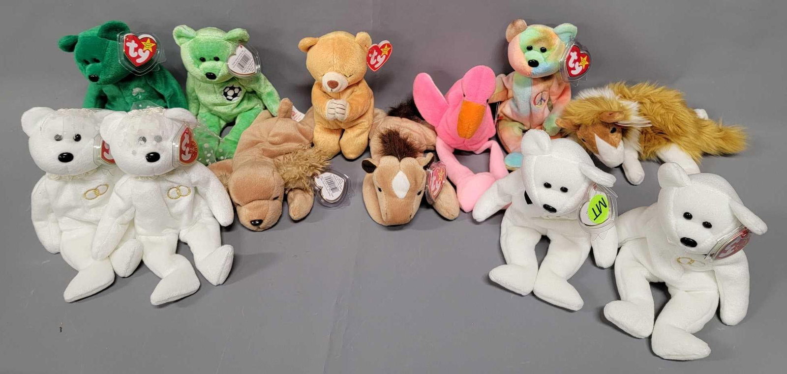 Group of twelve Ty Beanie Babies: This group of Beanie Babies is from an adult owned collection, all bought new when they were offered back in the mid 1990's, never played with and from a smoke and pet-free home. Group includes Ho