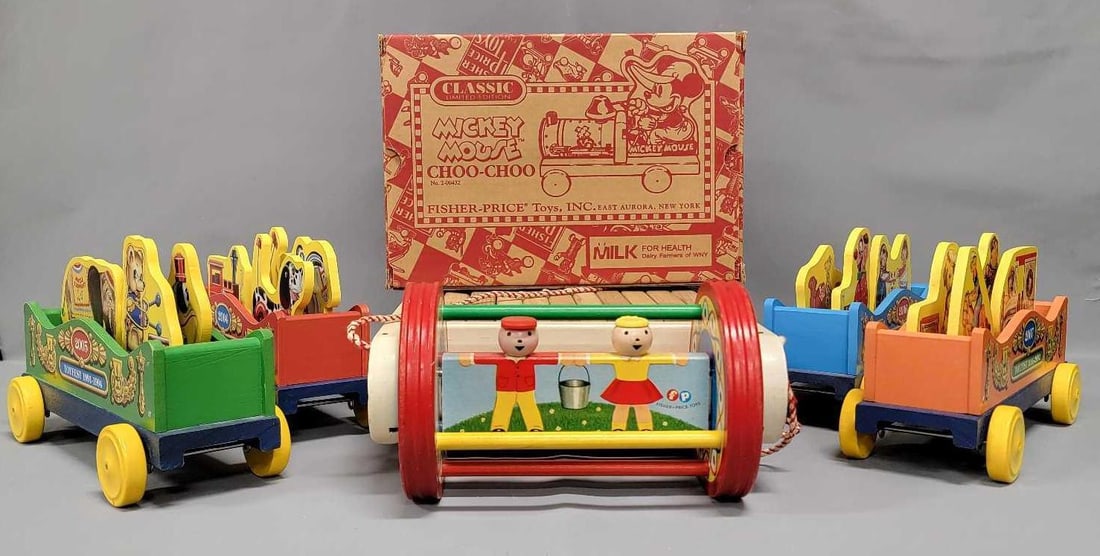 Five vintage and modern reproduction Fisher Price toys: Five vintage and reproduction Fisher Price toys include a vintage Timber Toter that is complete and in excellent condition plus reproduction no 200432 Mickey Mouse Choo Choo in excellent original box,