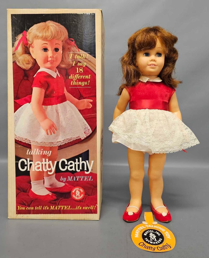 Talking Chatty Cathy auburn doll by Mattel in original box: Talking Chatty Cathy doll by Mattel stock no 745 with auburn hair is in excellent condition. Her pony tail holders are missing from her hair. Original box is in excellent condition as seen in the phot