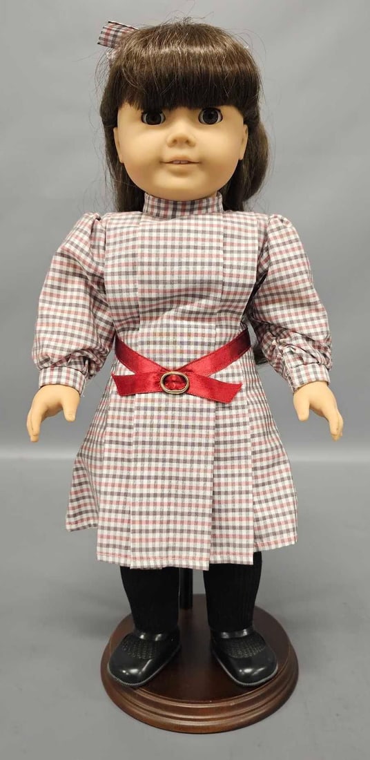 Original vintage retired American Girl doll Samantha by Pleasant Company: Original vintage retired American Girl doll Samantha is in excellent condition wih tight working limbs and comes with stand. Outfit is not complete, it includes dress, matching hair bow,panties, black