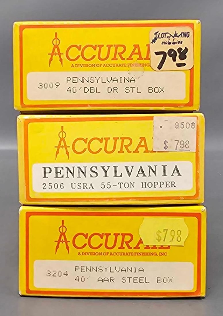 Three Accurail Pennsylvania Boxcar and Hopper car kits in original box: Three Accurail Pennsylvania Boxcar and Hopper car kits. Consists of 40 foot Double Door Steel Boxcar stock number 3009 road number 65387, 55 ton Hopper car stock number 2506 road number 220152 and a 4