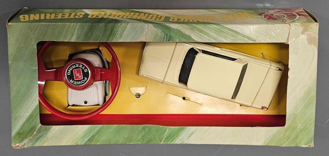 AMT 1/25 slot car Accessory Pack with 1962 Mercury Slot car TC-203: AMT 1/25 slot car Accessory Pack with 1962 Mercury Slot car and steering wheel, stock number TC-203. Hard to find in original box. Car and controller are mint in a very good original box that has tape