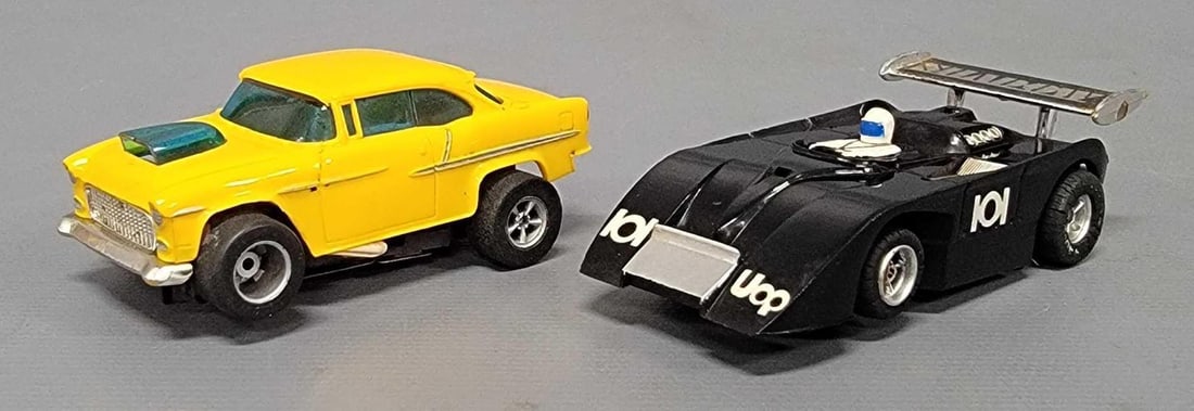 Two AFX HO slot cars: Two AFX HO slot cars to include 1955 Chevy Belair and a Black Shadow Can-Am car, both cars are in excellent condition as seen in the photos but neither will run.