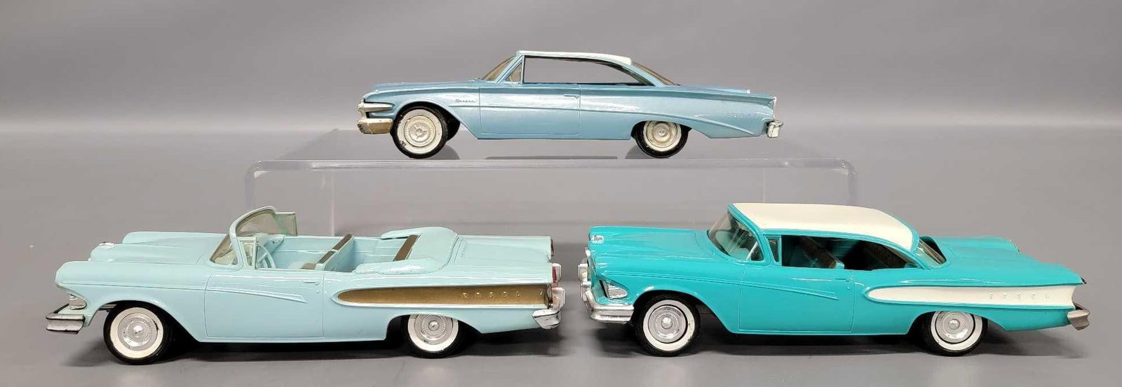 Three Edsel friction promo cars: Three Edsel friction promo cars to include 1958 convertible in ice green and gold plus a hardtop in turquoise and white, both excellent to near mint; and a 1960 hardtop in powder blue that is in excel