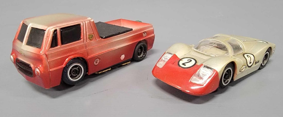 Group of two Tyco pro Trick Truck and Porsche 908 slot cars: Group of two Tyco pro slot cars. Includes Trick Truck, and Porsche 908 long nose. Both bodies show light wear the harder to find long nose 908 decals are intact. Both pro chassis are tested and workin