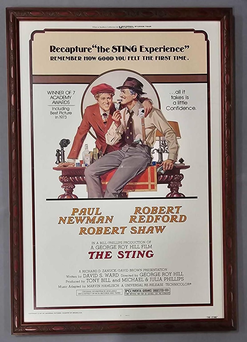 The Sting 1977 reissue glass framed movie poster: The Sting 1977 reissue glass framed movie poster, measures 42 1/2 X 29 1/2 inches and has been folded and was framed by Buffalo Picture Frame in New York as seen in the photos.