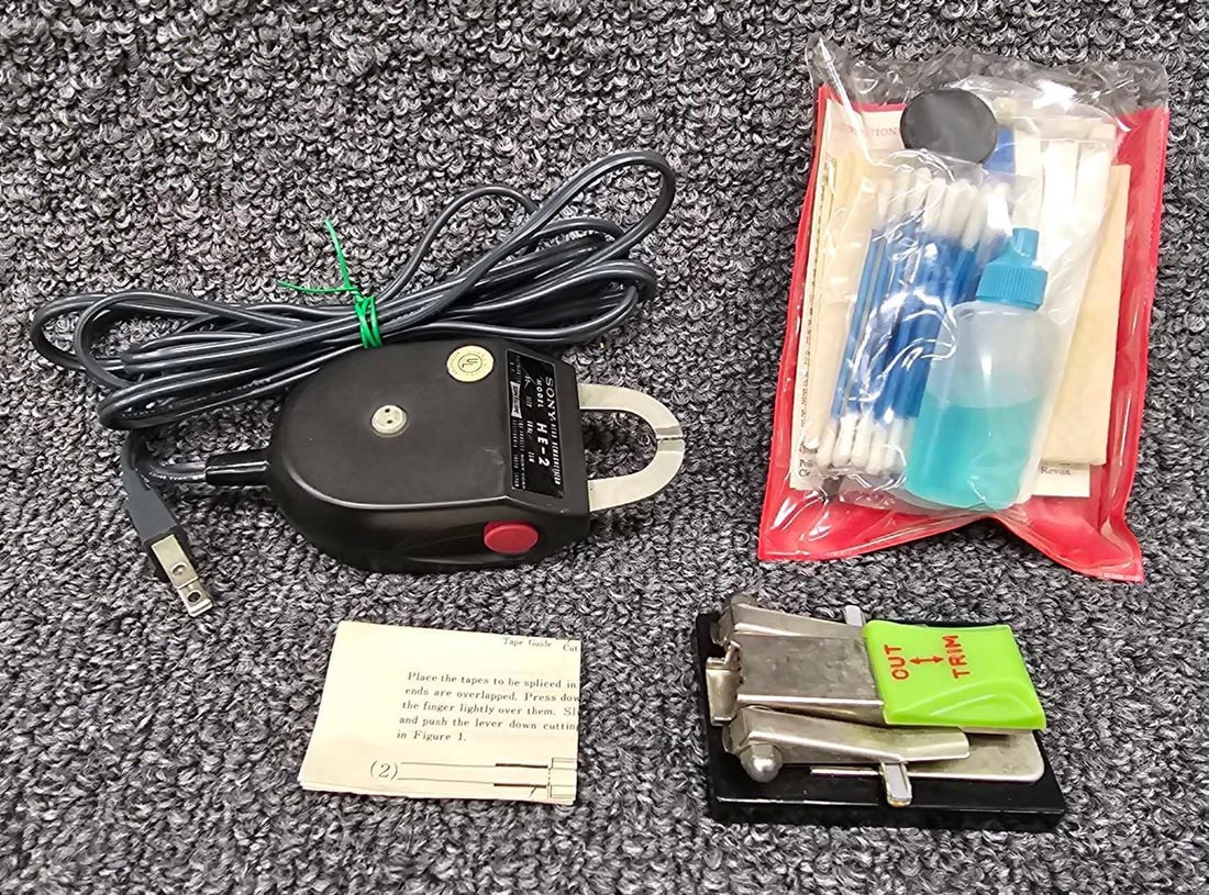 Small group of reel to reel care and use products: Small group of reel to reel care and use products to include a Sony HE-2 head demagnetizer, Revox cleaning kit and a tape splicer with original instruction sheet, made in Japan. All in very good to ex