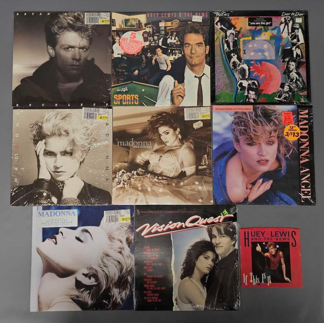 Group of nine 1980's pop / rock vinyl LPs: Group of nine 1980s pop / rock vinyl LPs and one 45 single, bands to include Huey Lewis and the News, Bryan Adams, The Cars and Madonna in very good to excellent condition as seen in the photos.