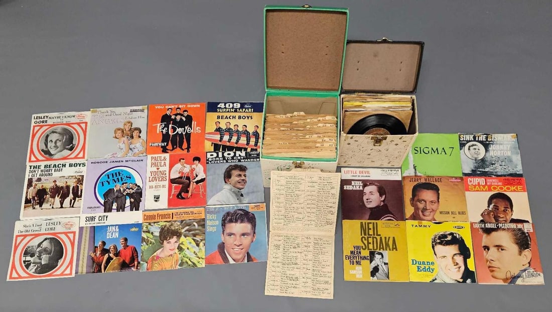One hundred twelve 1960's and 1970's vinyl 45 singles in two carrying cases (1 of 7)
