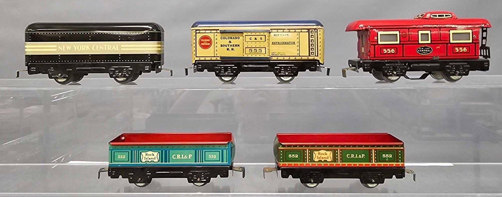 Five Marx O gauge tin lithographed freight cars with slot and tab couplers: Five Marx O gauge tin lithographed freight cars with slot and tab couplers to include two different 552 Rock Island gondolas, 555 Colorado and Southern reefer, New York Central tender and 556 New York