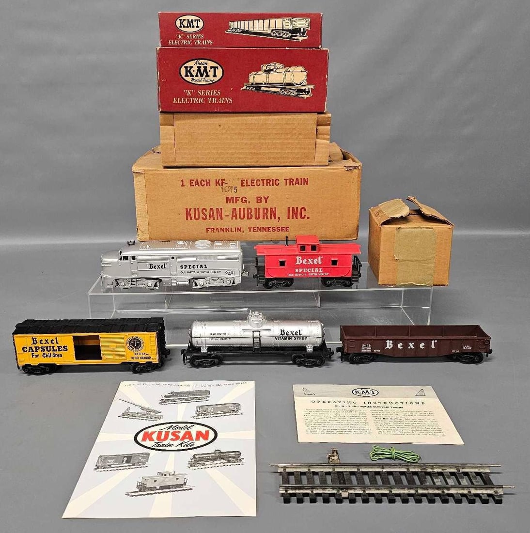 Fantastic Boxed Kusan O gauge Bexel diesel freight set KF-1015: Fantastic Boxed Kusan O gauge Bexel Vitamin Company diesel freight set, stock number KF-1015, includes Alco FA diesel locomotive, box car, tank car, gondola and caboose, a tested and working transform