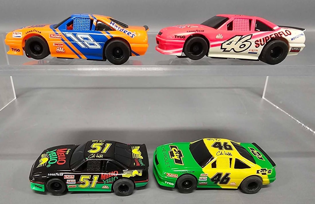 Four Tyco Magnum 440-X2 HO Days of Thunder HO slot car: Four Tyco Magnum 440-X2 HO slot car Days of Thunder slot cars to include 18 Hardees. 46 City Chevrolet, 46 Superflo and 51 Mello Yello, all near mint to mint and only one car shows light run time as s