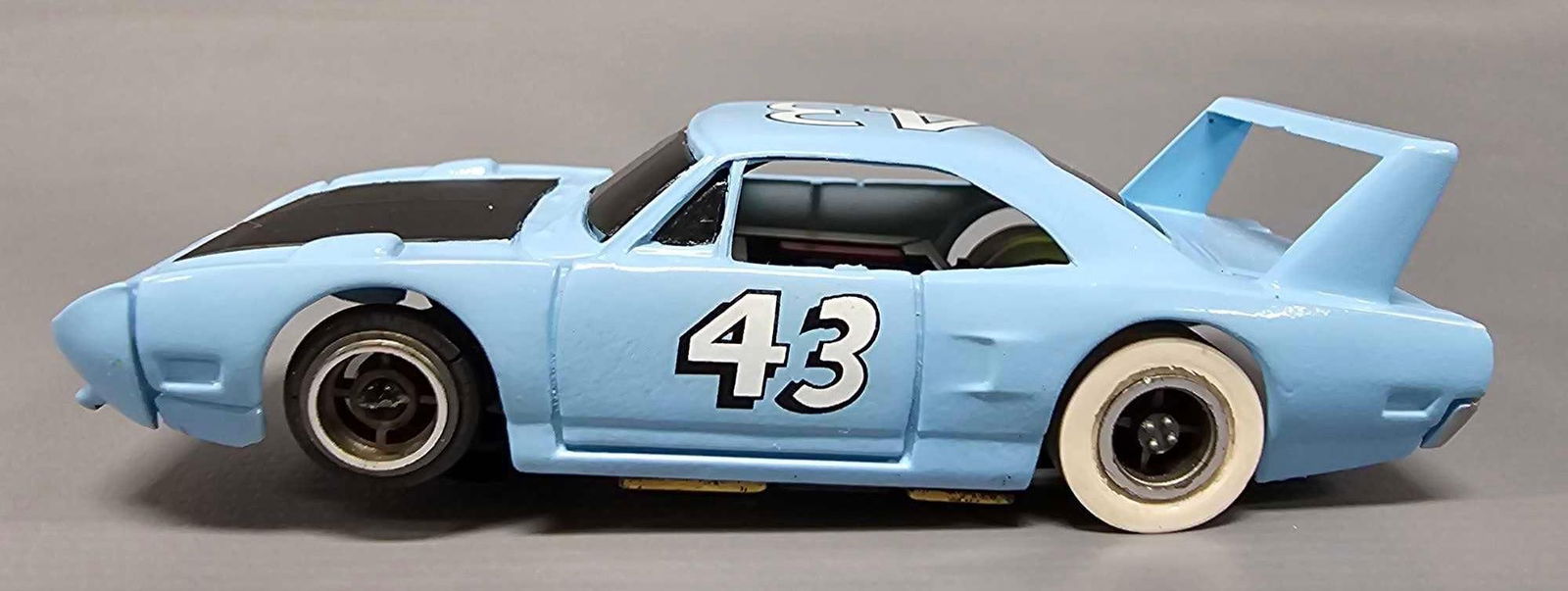 Restored Tycopro #43 Richard Petty Plymouth Superbird HO slot car: Restored Tycopro #43 Richard Petty Plymouth Superbird HO slot car. The body was molded in white and appears to be an original that has been repainted and had new decals put on. The decals are too skin
