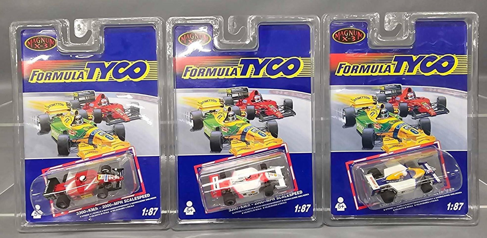 Three Formula Tyco M-3 HO slot cars on blister cards: Three Formula Tyco M-3 HO slot cars on blister cards to include 90009 Agip Ferrari, 90011 Shell McLaren and 90015 Canon Elf Renault, all three are mint on excellent to near mint cards as seen in the p