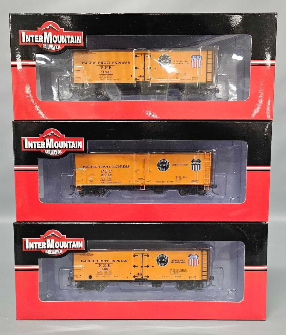 Three Intermountain Railway Southern Pacific Pacific Fruit Express wood reefer cars in OBs (1 of 7)