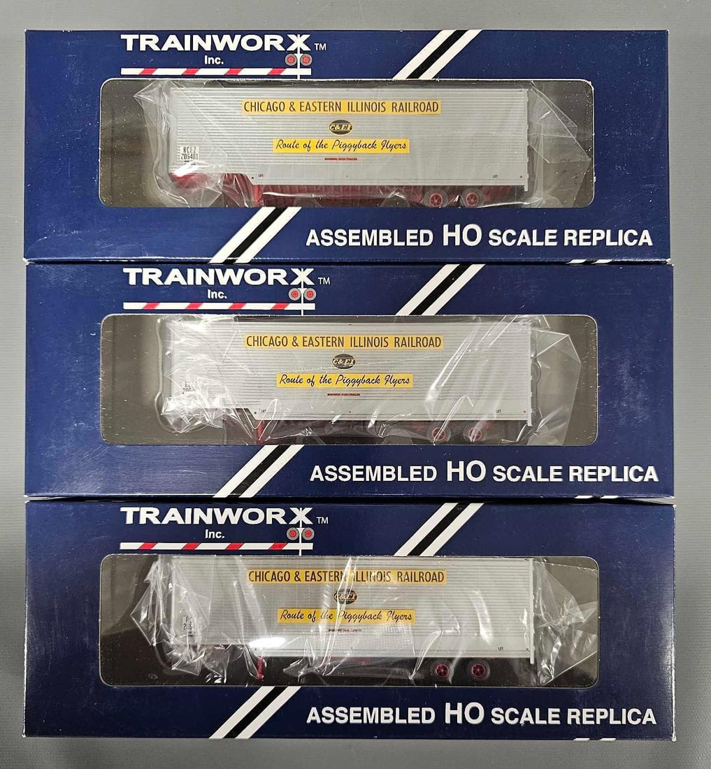 Three Trainworx Chicago and Eastern Illinois 40' drop frame vans in original boxes: Three Trainworx Chicago and Eastern Illinois 40' drop frame vans in original boxes, all three are different with stock numbers 80303-01, -02 and -03, C9-10 in near mint original boxes.