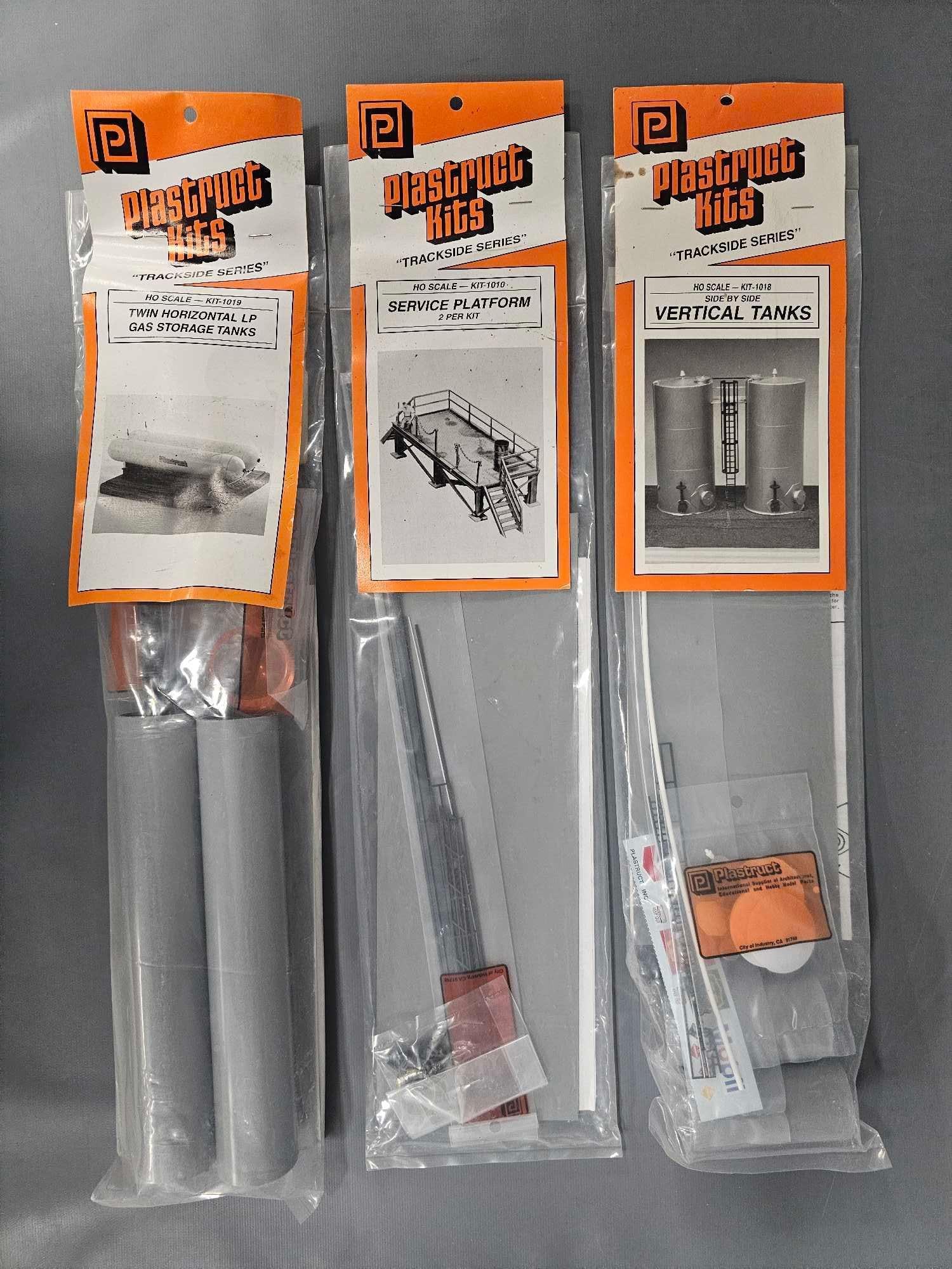 Three Plastruct HO scale building kits in sealed packages (1 of 2)