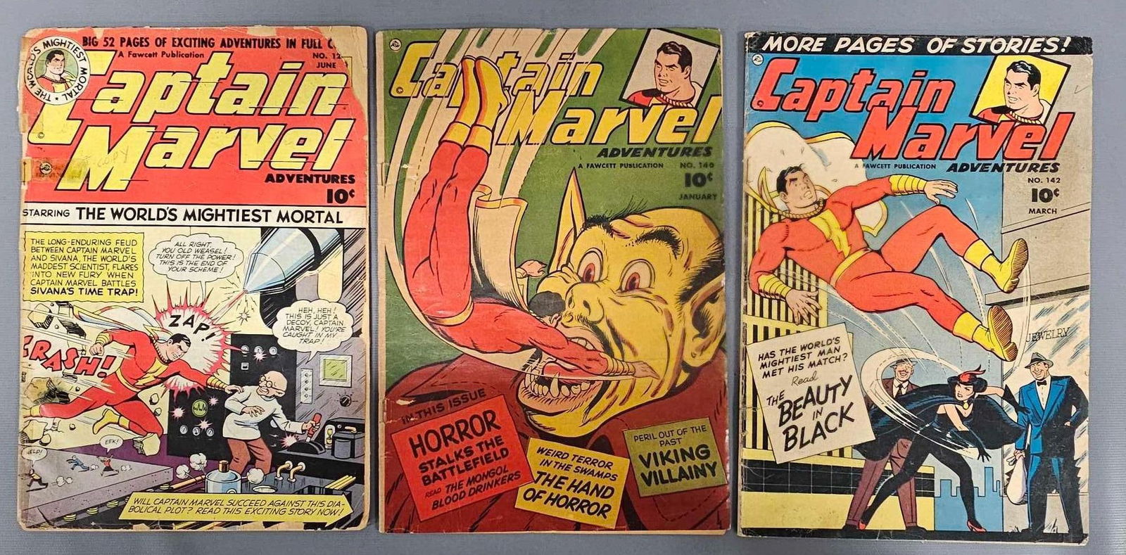 Captain Marvel Adventures 121 140 142: Captain Marvel Adventures 121 low grade, tape on spine 140 staple tears but attached, cover very tanned. 142 small tape on spine as seen in the photos.