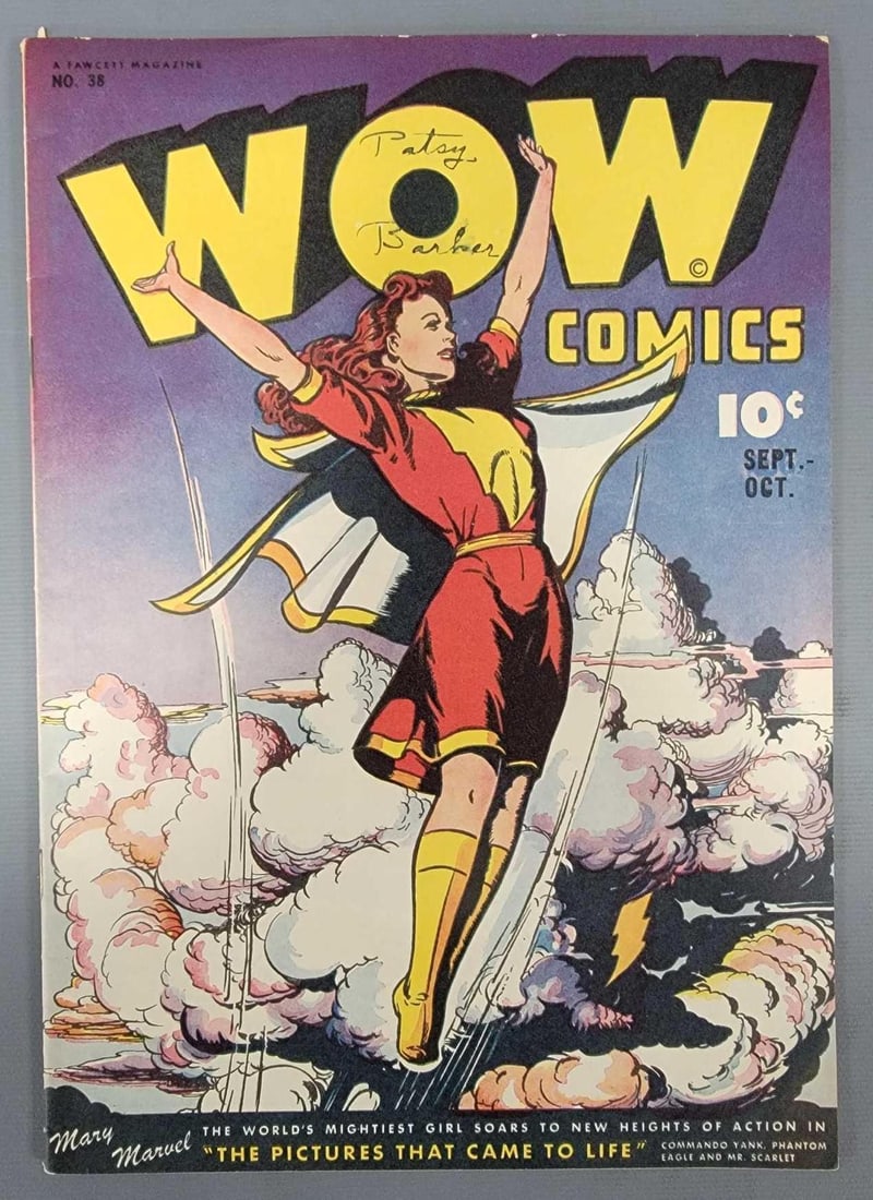 Wow Comics 38 Classic Mary Marvel Cover: Wow Comics 38 Classic Mary Marvel Cover. Small tear at top spine, light edge wear, name on cover as seen in the photos.