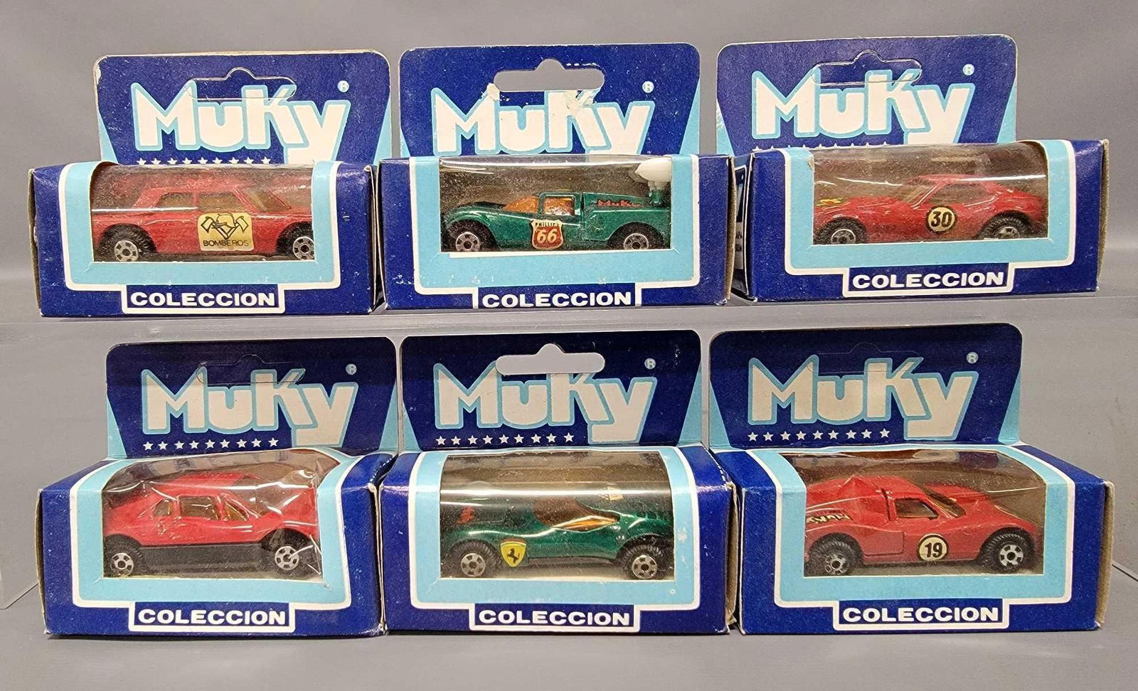 Six Muky die cast cars in original boxes: Six Muky die cast cars in original boxes to include stock numbers 8 Lola Gt Spoilr, 18 Ford MK IV, 22 Lamborghini, 35 Bombero and 39 Ferrari 308 and a Castrol Corvette with no stock number, all excell