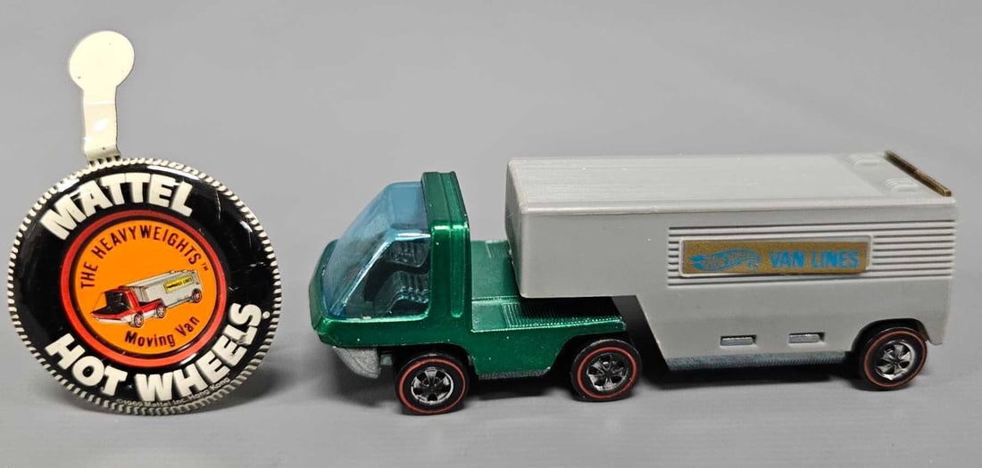 Redline Hot Wheels Heavyweights green Moving Van with flat rear door and button: Redline Hot Wheels Heavyweights green Moving Van with flat rear door and button. Cab is excellent plus with a near mint gray trailer that has a smooth rear door and shiny bases on both pieces with an