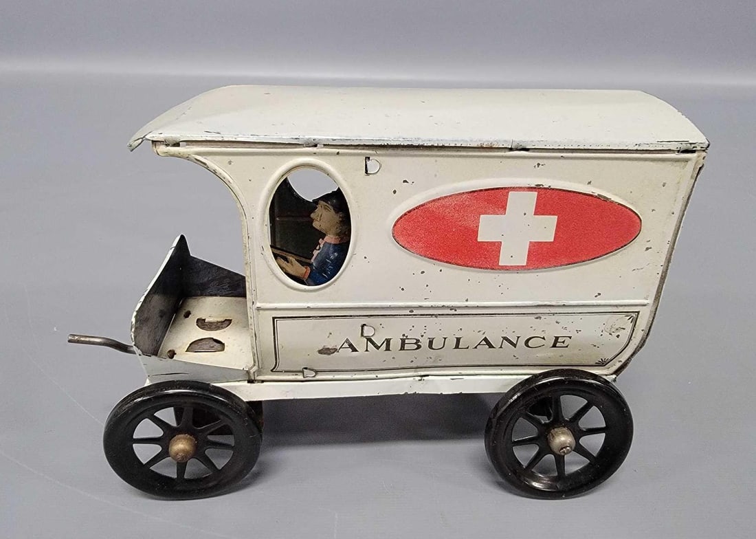 Scarce AC Gilbert tin clockwork ambulance: Scarce AC Gilbert tin clockwork ambulance, a very hard to find toy that is in very nice shape with driver and works nicely. Measures 8 inches long.