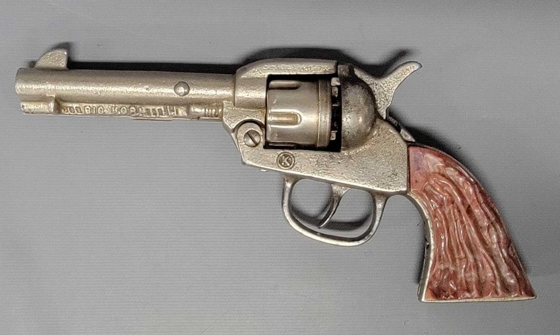 Kilgore Big Horn cast iron cap gun with swirl maroon grips: Kilgore Big Horn cast iron cap gun with swirl maroon grips, excellent overall condition with some play wear and caps fired through but no corrosion anywhere, operates perfectly and the grips are damag