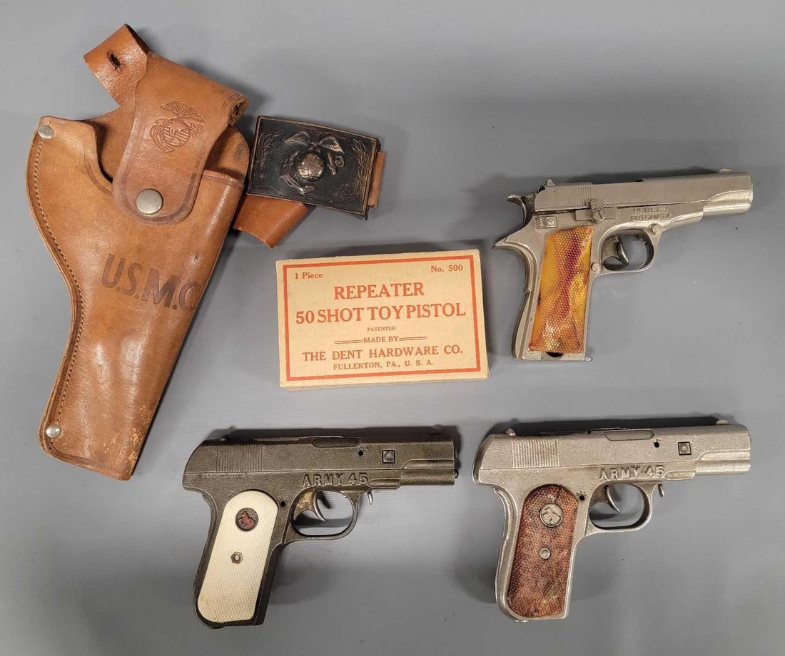 Three vintage Army 45 cap guns with a holster and an empty original box: Three vintage Army 45 cap guns with a holster and an empty original box for a Dent Hardware Co Repeater 50 shot toy pistol. All three fire perfectly, the two cast iron Army 45 pistols open perfectly a