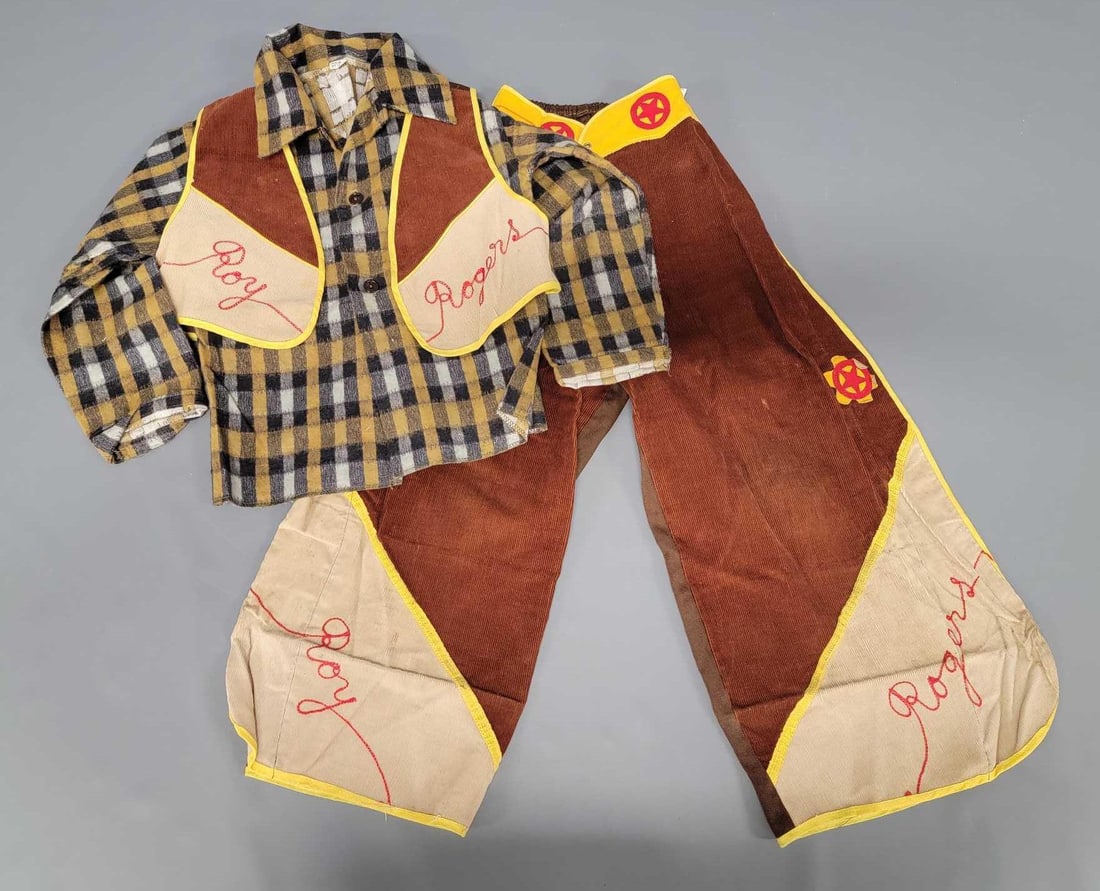 1950s Children's Roy Rogers play outfit: 1950s Childrens Roy Rogers play outfit. Includes a plaid shirt, vest and pants with built in chaps. The pants and vest are both adorned with Roy Rogers stitching. The pants were hemmed way up but I cu
