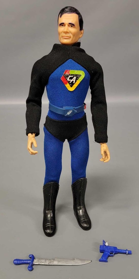 Ideal Captain Action figure with pistol and repaired sword: Ideal Captain Action figure with pistol and repaired sword. The figure is complete but the right foot can come off because the part that goes up into the ankle was sheared off. The joints are tight an