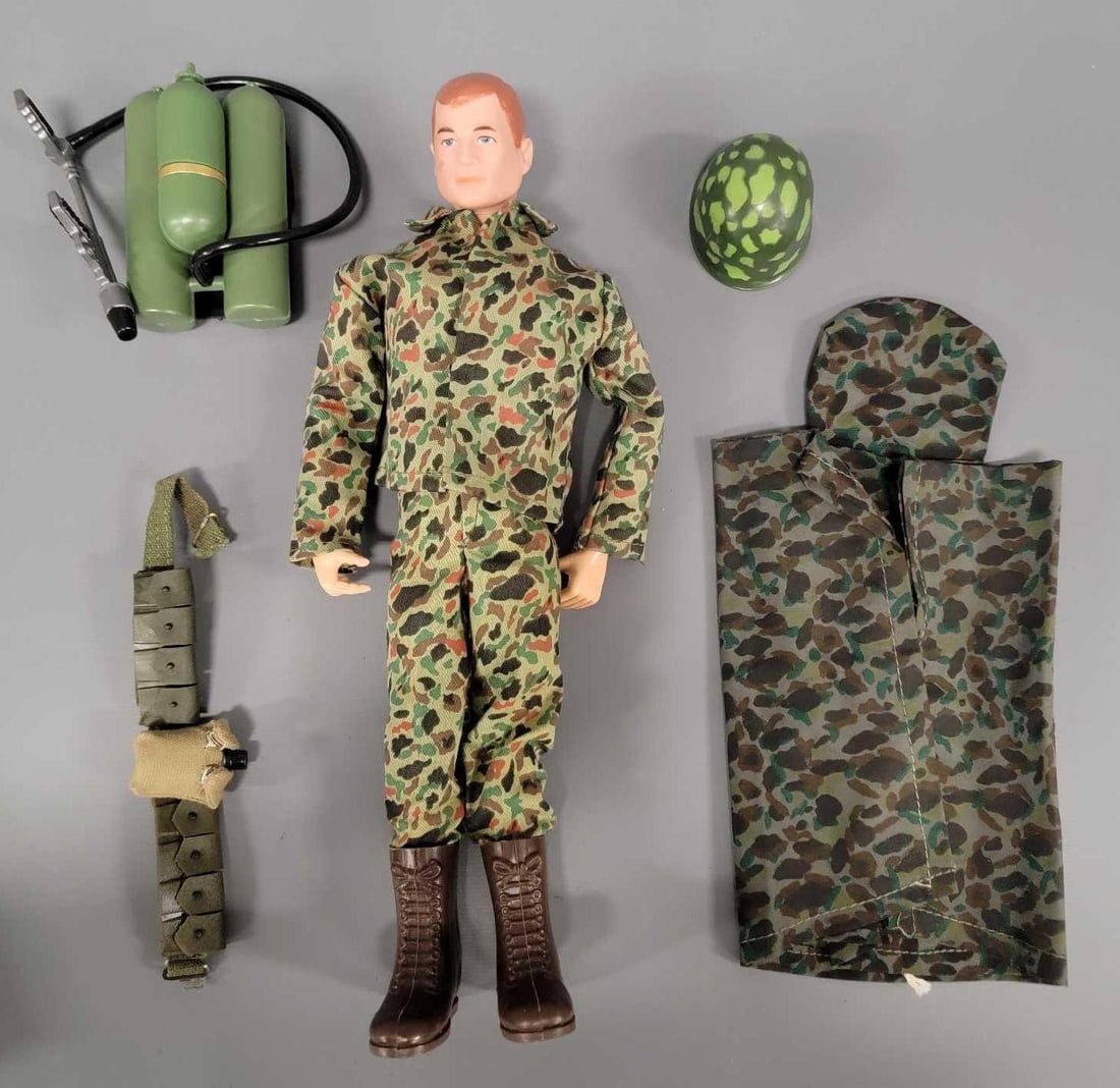 Hasbro GI Joe patent pending action Marine: Hasbro GI Joe patent pending action Marine with a loose lower right leg, great face and head paint, cracks on both upper biceps and all four upper thigh rivets. The outfit is very nice and clean with